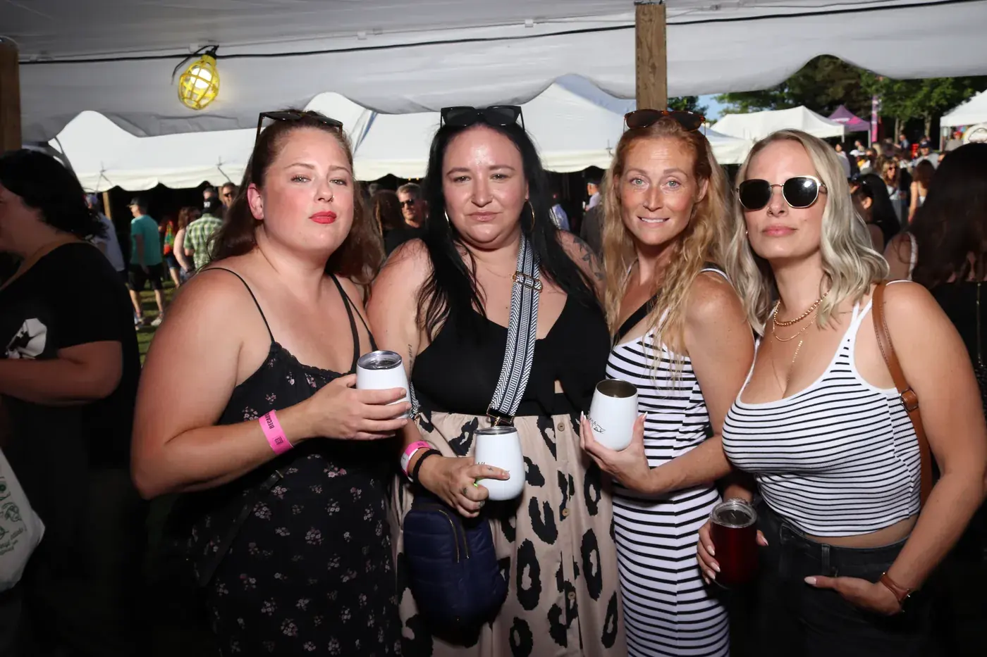Guests in the Aura photo booth at a busy event